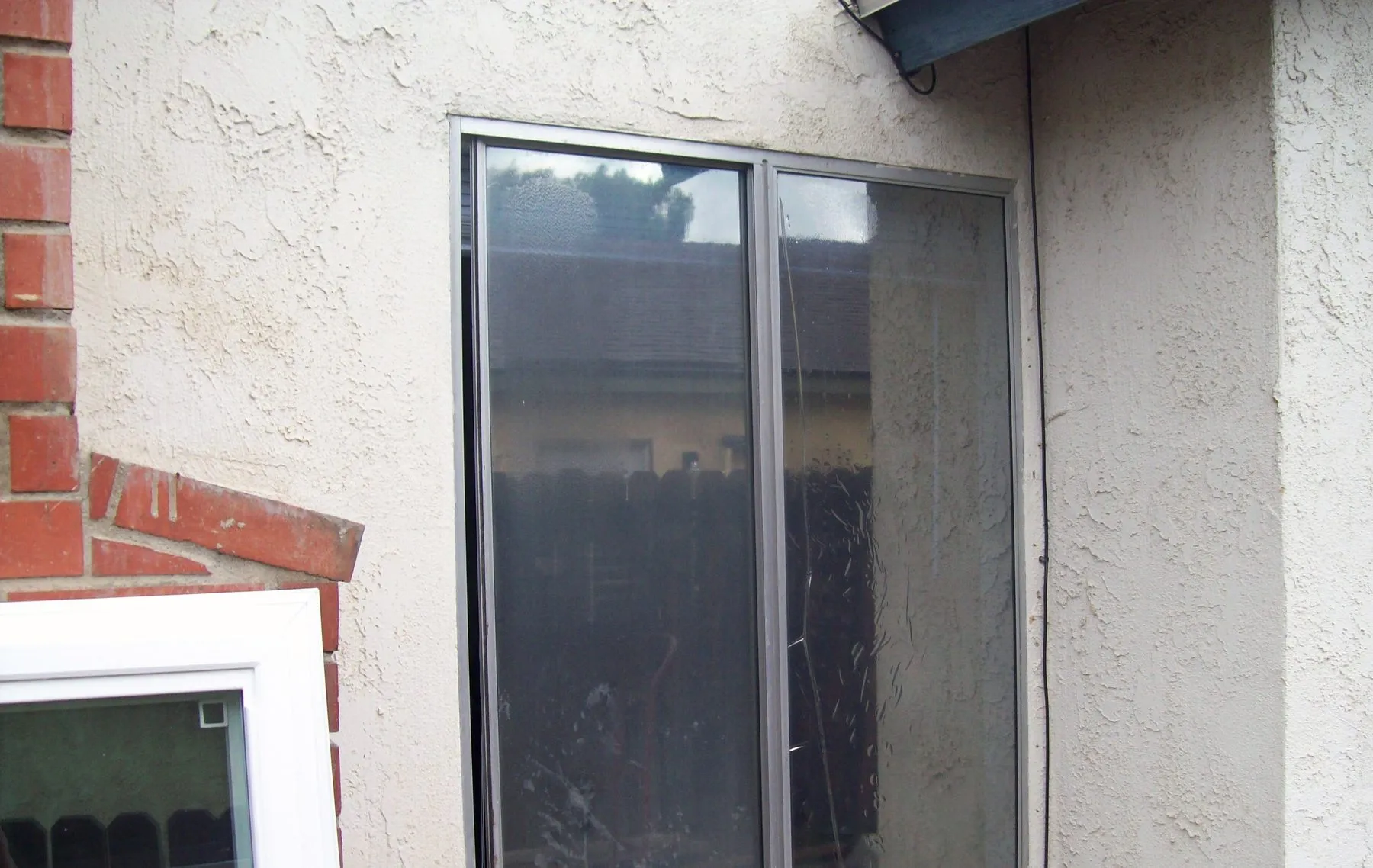 Before: a bedroom window before and after replacement