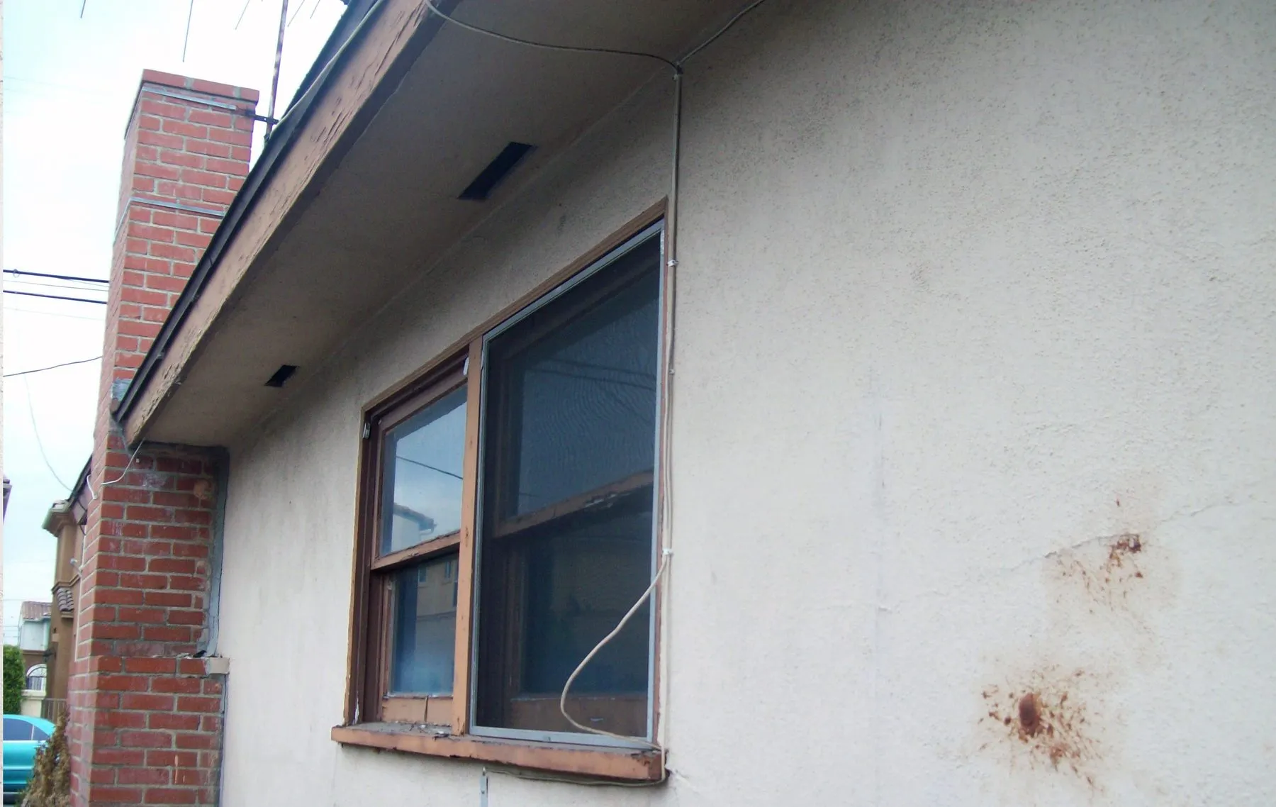 Before: a corner sliding glass door before and after replacement