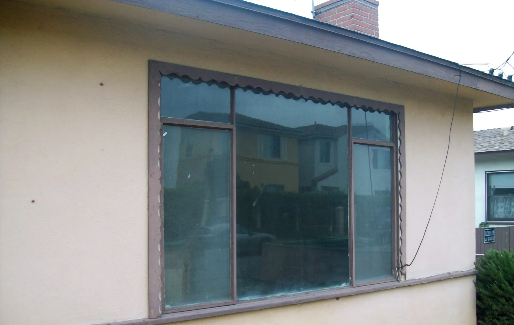 Before: a whole-house window replacement on a Riverside-area home